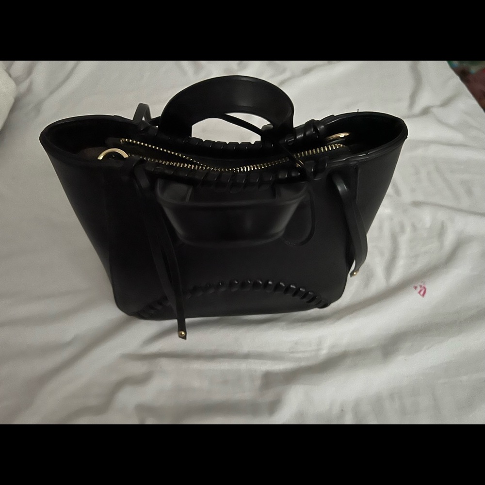 It’s a soft black hand bag